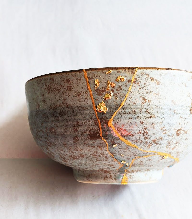 Kintsugi Repair: Gold color plus resin embedded with gold flakes by Fan Stanbrough